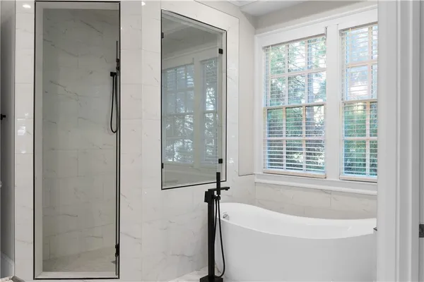 a bathroom with a toilet a sink a vanity and mirror