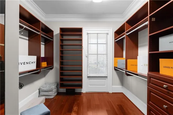 a view of a dining room with furniture wooden floor and a chandelier