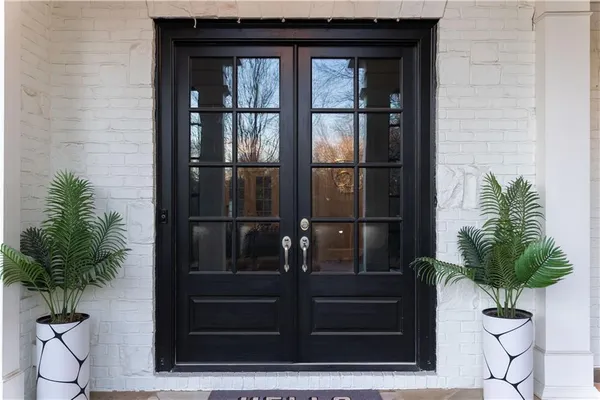 a view of a livingroom with furniture and hardwood floor