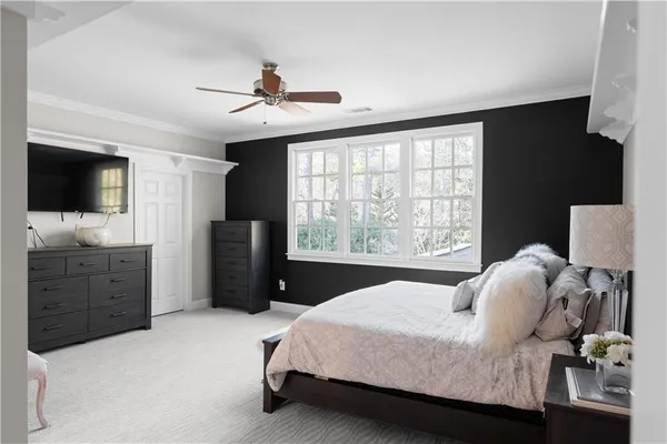 a front view of a house with potted plants