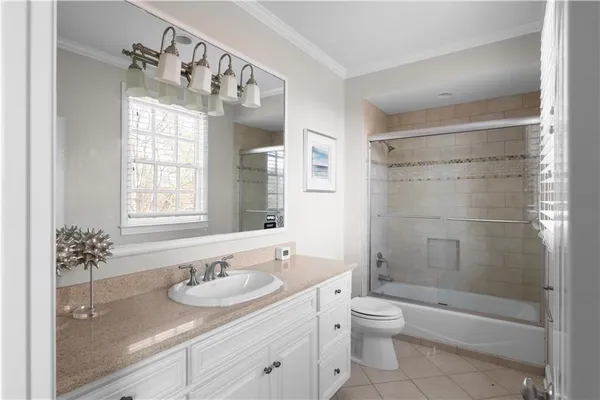 an aerial view of a house with yard and sitting space