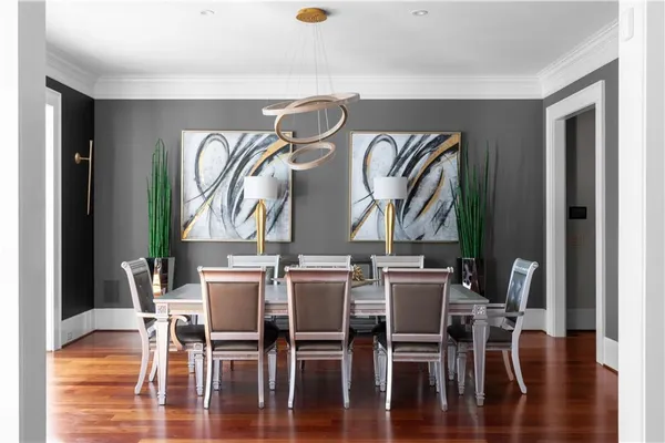 a view of a dining room with furniture window and wooden floor