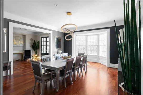 a kitchen with a wooden floor and a fireplace