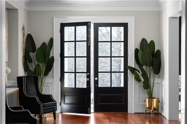 a view of a dining room with furniture window and wooden floor
