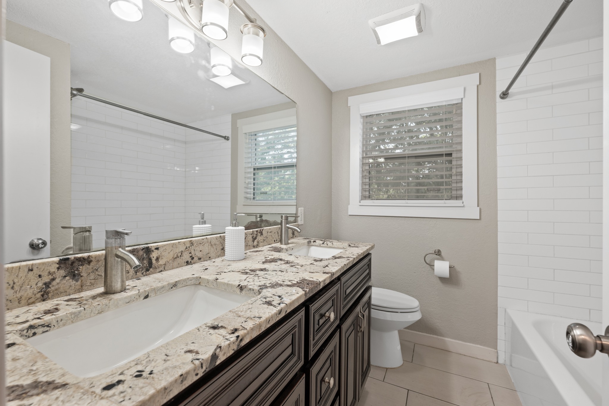 1801 Ohlen Road Austin, TX 78757 - Photo 32 of 32 Actual upstairs bathroom photo.