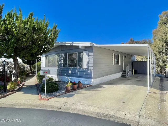 a front view of a house with a garage