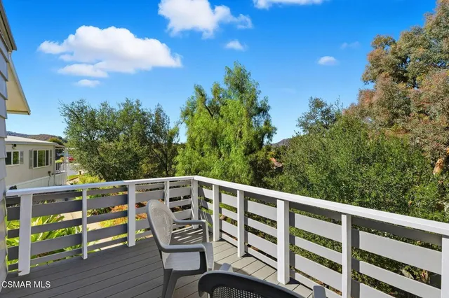 a view of a chair and table on the wooden floor