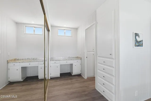 a room with a dresser and a stove