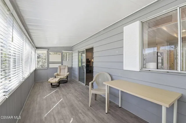 a living room filled with furniture and a window