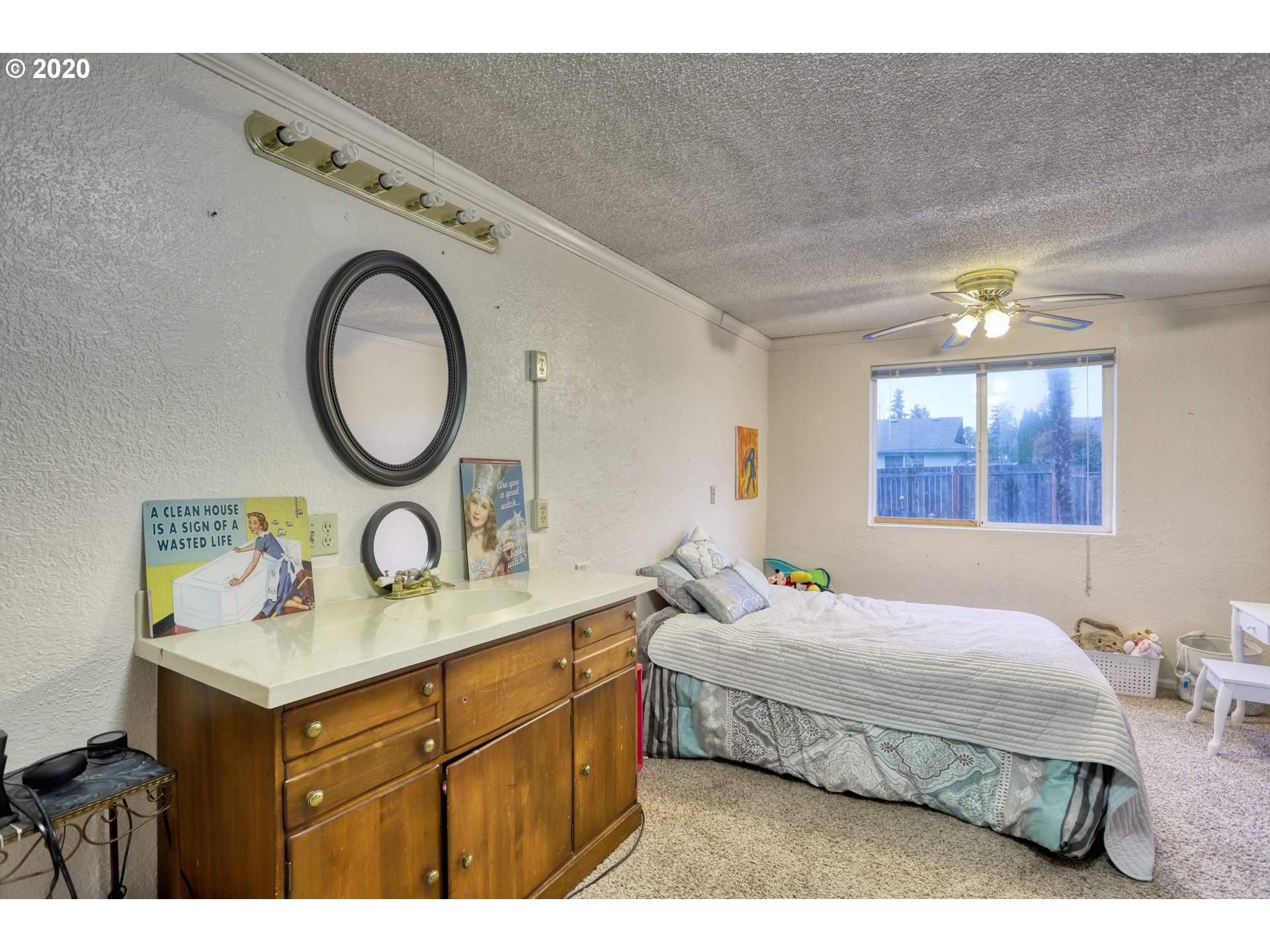 356 71st Street Springfield, OR 97478 - Photo 13 of 32 a bedroom with a bed and attached with the bathroom