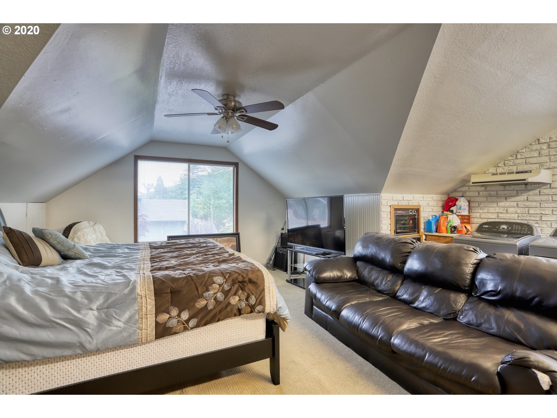 356 71st Street Springfield, OR 97478 - Photo 17 of 32 a bedroom with a bed couch and window