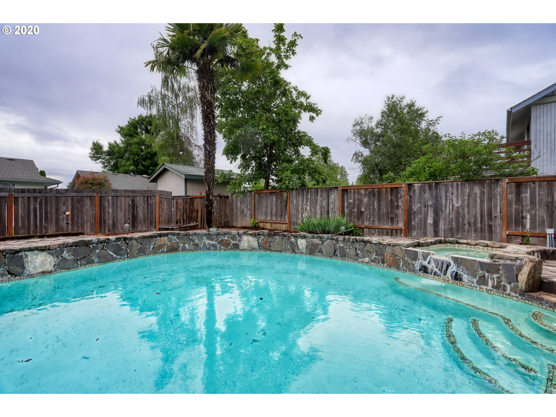 356 71st Street Springfield, OR 97478 - Photo 24 of 32 a view of a backyard with swimming pool and furniture