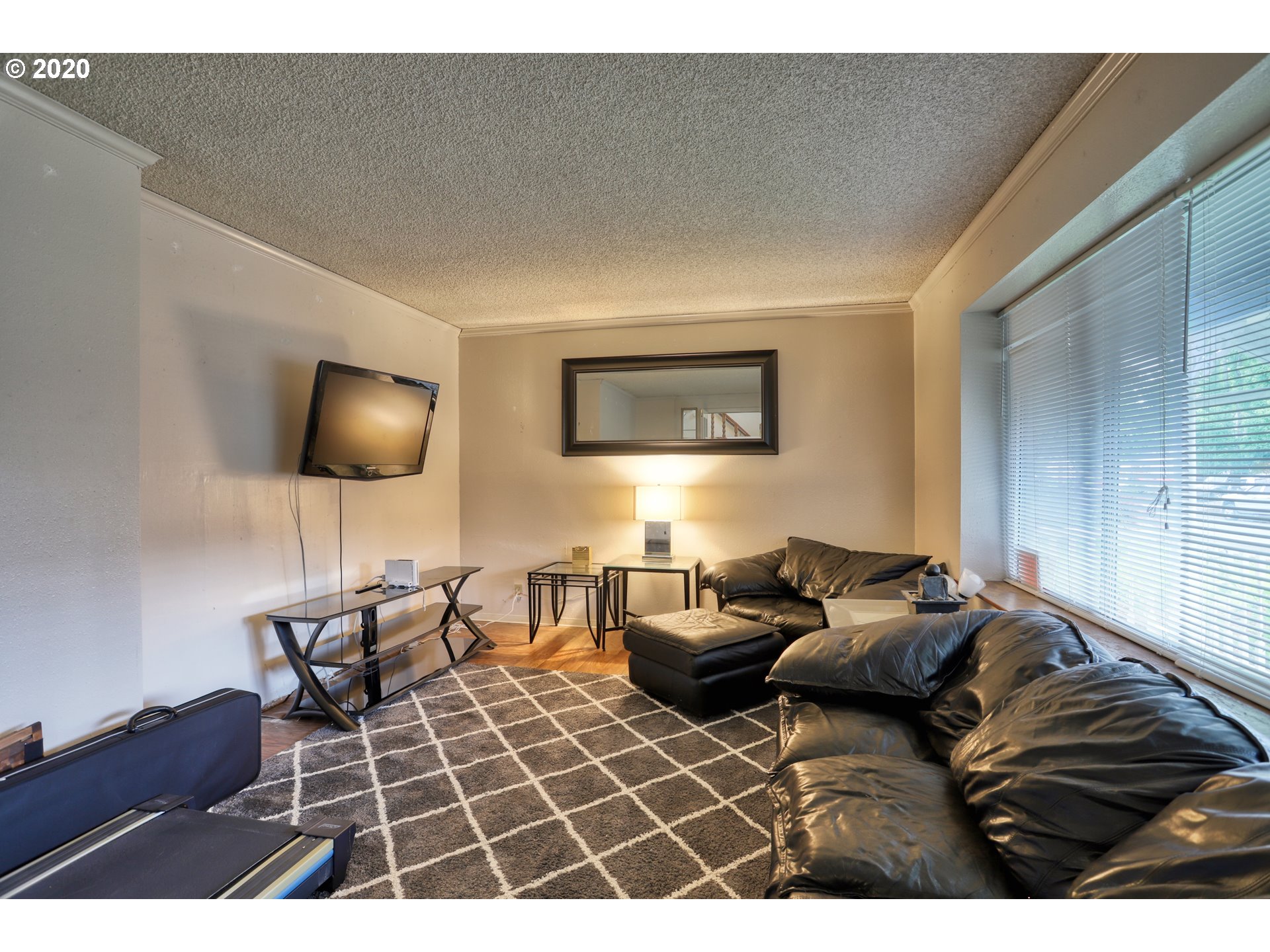 356 71st Street Springfield, OR 97478 - Photo 5 of 32 a living room with furniture a flat screen tv and lamp