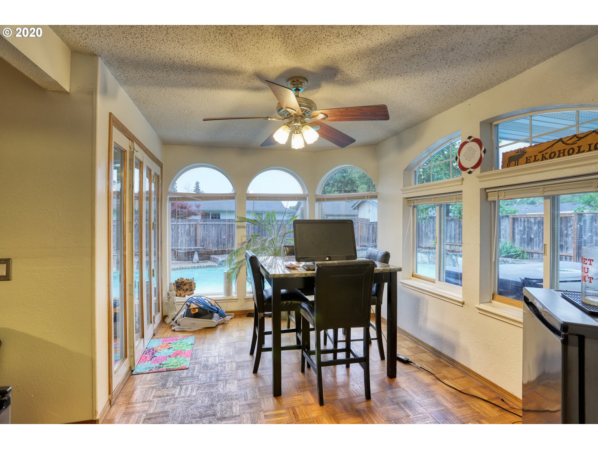 356 71st Street Springfield, OR 97478 - Photo 6 of 32 a view of a dining room with furniture a chandelier and wooden floor