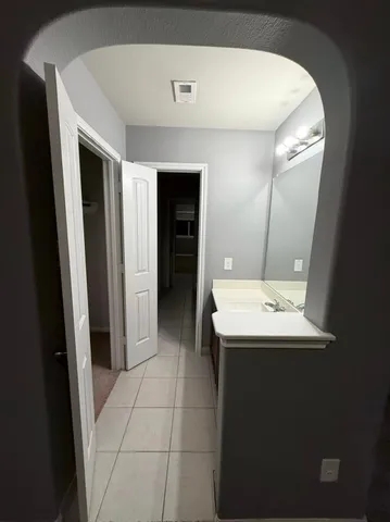 an empty room with a empty space and windows