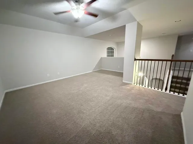 wooden floor in a hall with a balcony