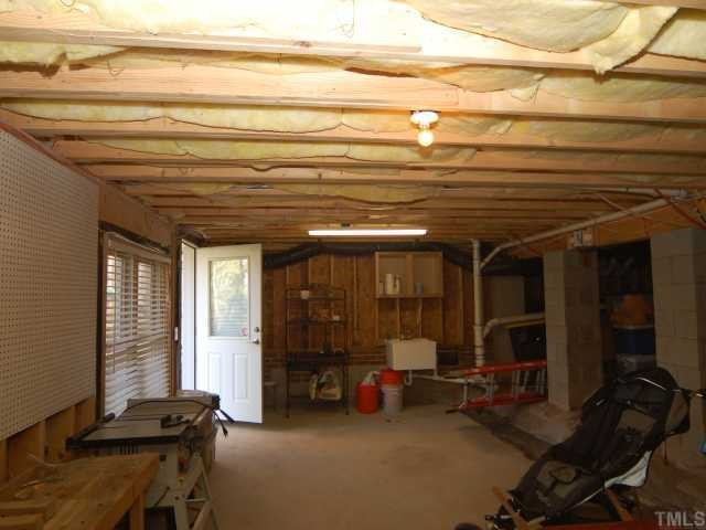5313 Levering Mill Road Apex, NC 27539 - Photo 11 of 12 Truly unusual! Huge (30X11.5) concrete-floored workshop and storage area is just the space for those woodwoking projects and a great place to store equipment. Two large windows let in lots of light, too! Workshop