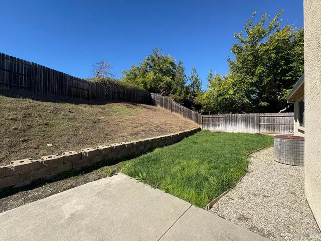 a view of a backyard with green space