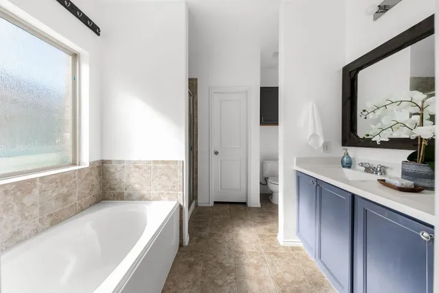 a bathroom with a bathtub and a sink