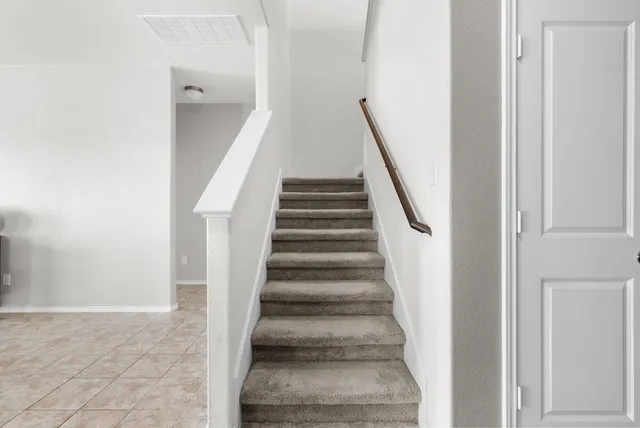 a view of staircase with white walls and white walls