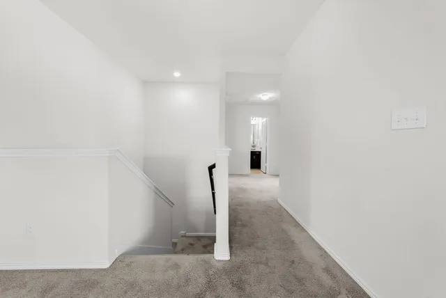 a view of a hallway with staircase