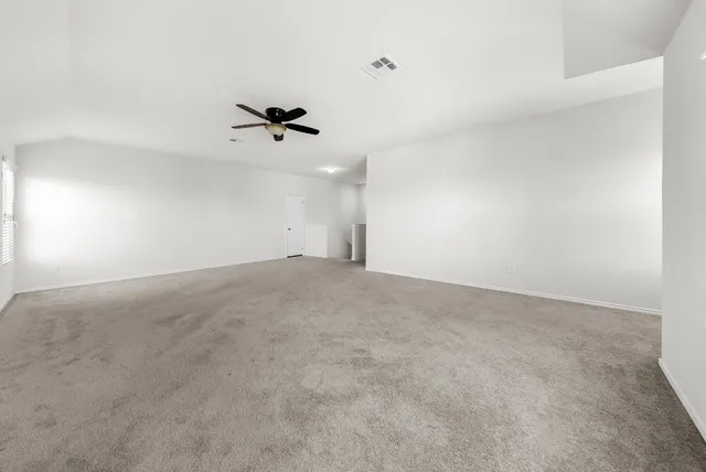 a view of a big room with carpet