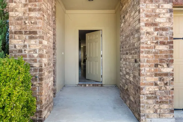 a view of a bathroom with a shower and a sink