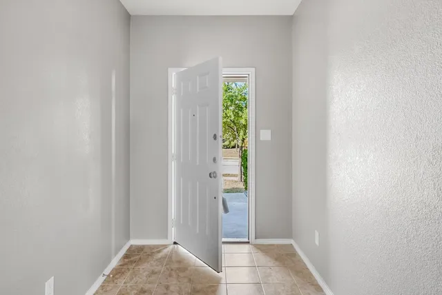 a view of room with window and stairs
