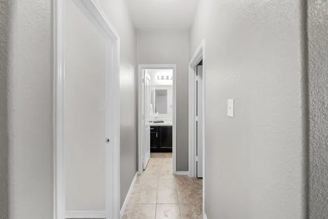 a view of a hallway with an entryway
