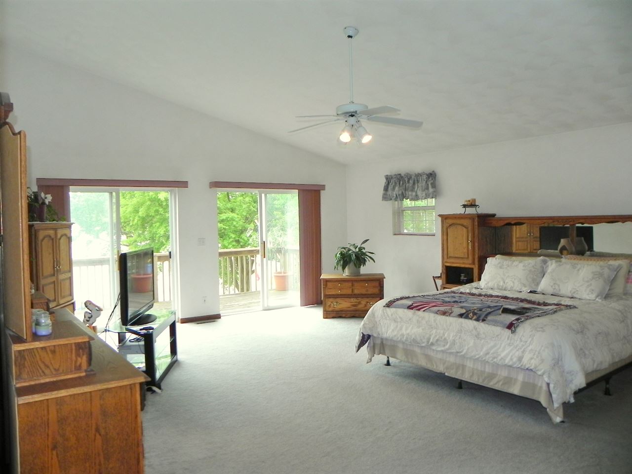 854 Breckenboro Road Lake Summerset, IL 61019 - Photo 6 of 24 a bedroom with a bed couch and large window