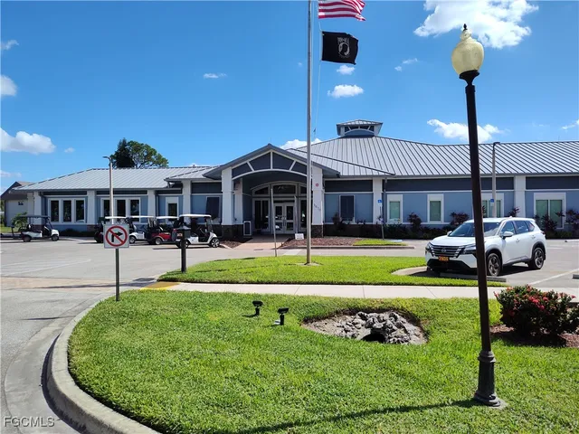 a front view of a house with a yard table and chairs