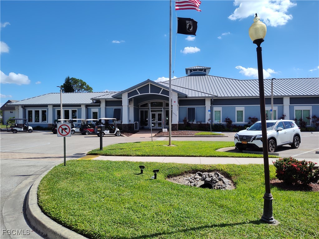 a front view of a house with a yard table and chairs