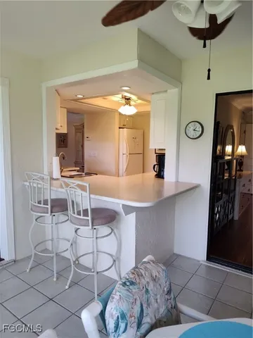 a living room with furniture and a clock