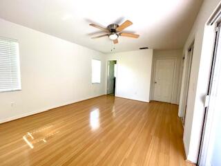 22175 General Street Boca Raton, FL 33428 - Photo 18 of 32 wooden floor in an empty room with a window