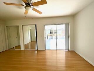 22175 General Street Boca Raton, FL 33428 - Photo 20 of 32 wooden floor in an empty room with a window