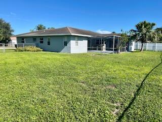 22175 General Street Boca Raton, FL 33428 - Photo 2 of 32 a front view of a house with a garden