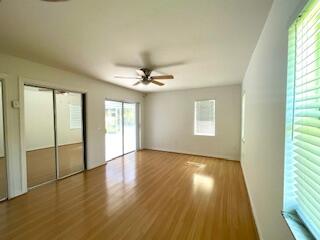 22175 General Street Boca Raton, FL 33428 - Photo 21 of 32 an empty room with wooden floor fan and windows