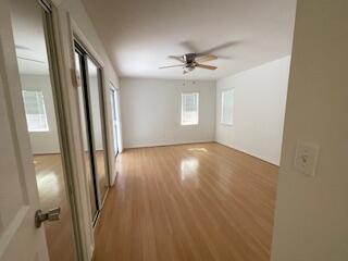 22175 General Street Boca Raton, FL 33428 - Photo 22 of 32 an empty room with wooden floor and windows