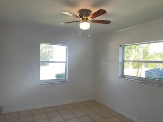 22175 General Street Boca Raton, FL 33428 - Photo 24 of 32 an empty room with a window and a fan