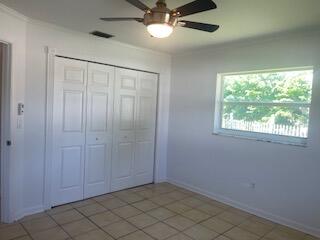 22175 General Street Boca Raton, FL 33428 - Photo 25 of 32 an empty room with windows and fan
