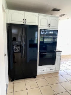 22175 General Street Boca Raton, FL 33428 - Photo 29 of 32 a kitchen with granite countertop a refrigerator and a stove