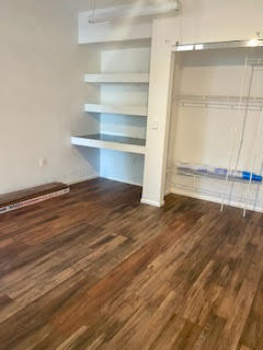22175 General Street Boca Raton, FL 33428 - Photo 31 of 32 a view of an empty room with wooden floor and a window