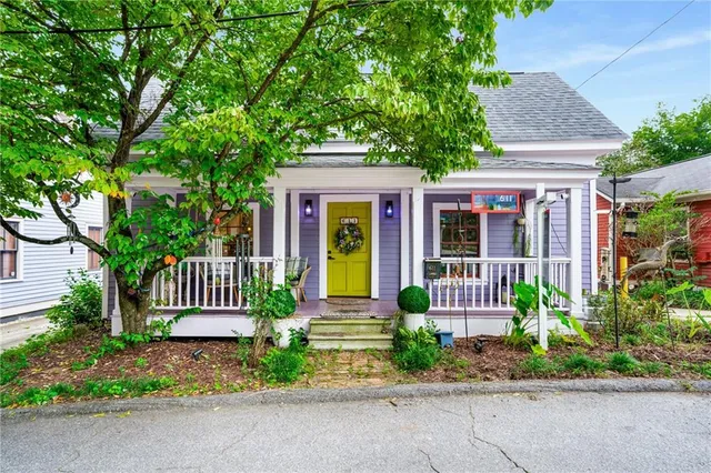 a front view of a house with garden