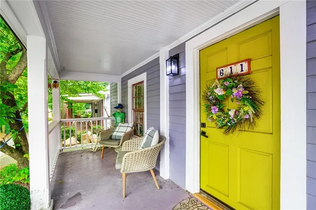 a balcony with furniture and a potted plant