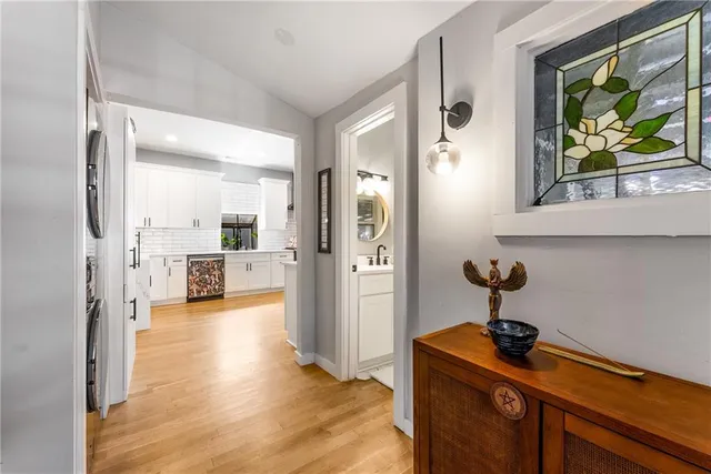 a view of a hallway with dining area