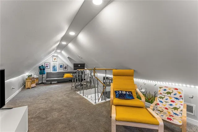 an outdoor room with chairs