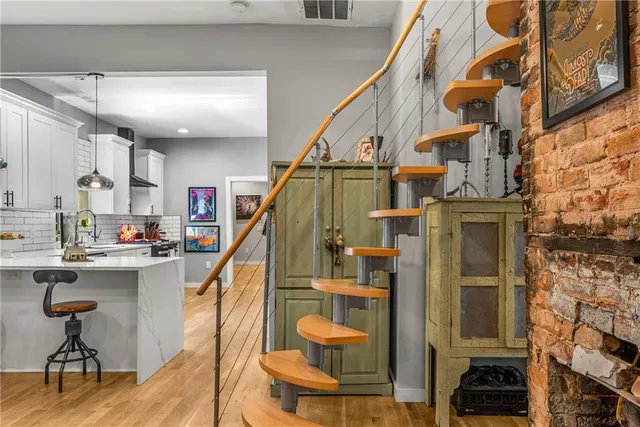 a view of a livingroom with furniture and staircase