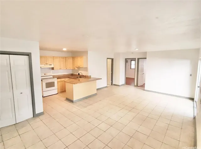 a view of empty room with windows