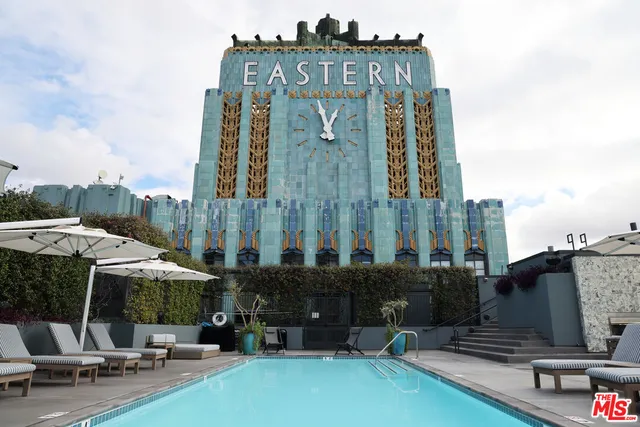 a living room filled with furniture and a flat screen tv