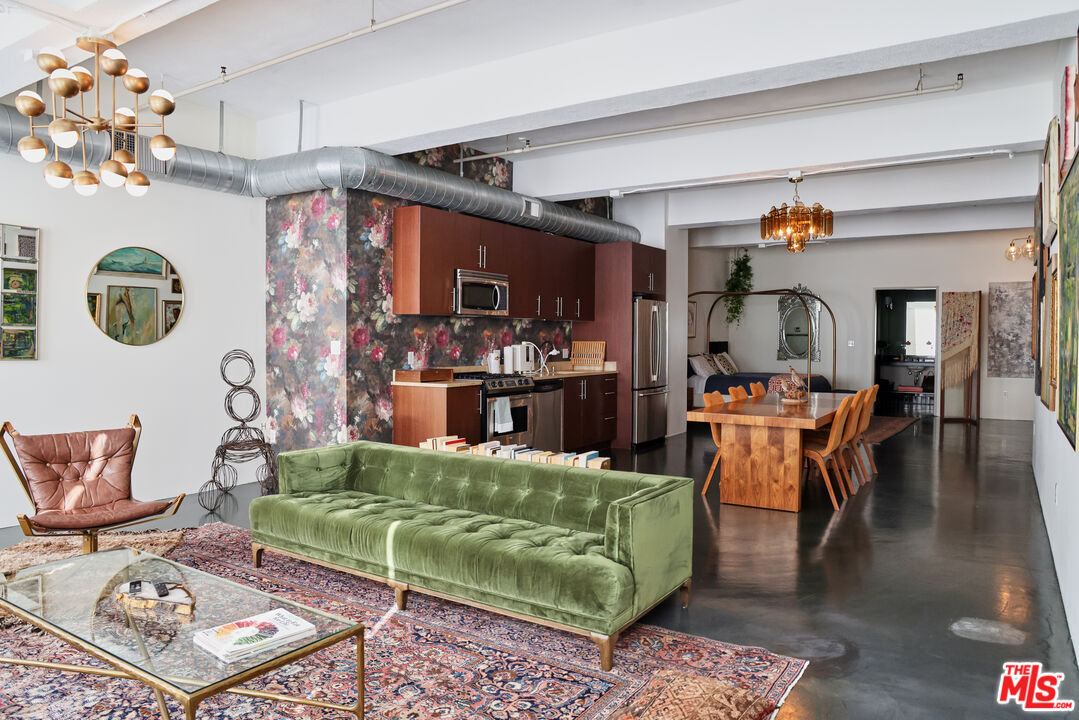 849 South Broadway, Unit 906 Los Angeles, CA 90014 - Photo 11 of 65 a living room with furniture and a rug